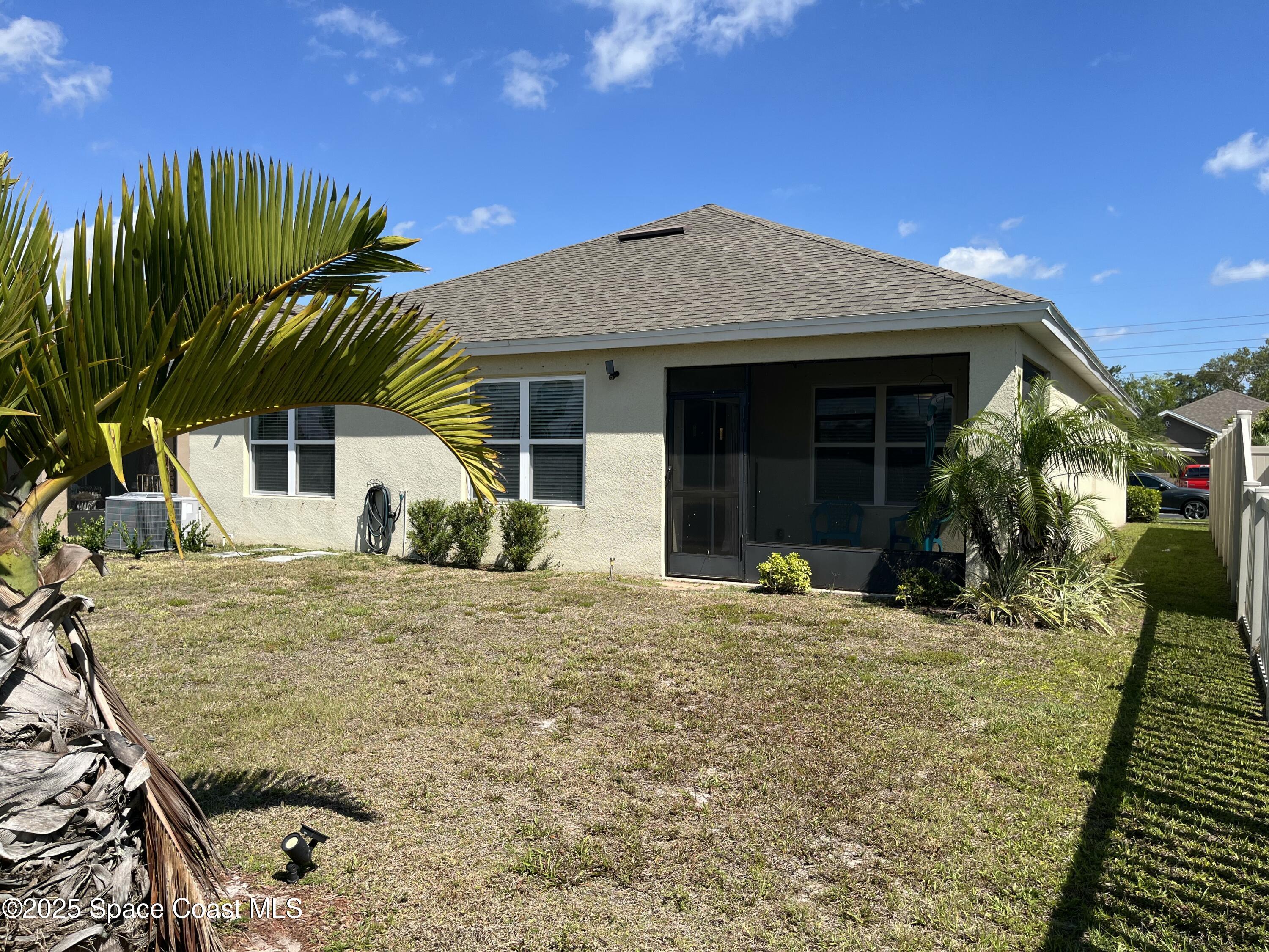 2209 McCormack Way Melbourne, FL 32935 - Photo 17 of 22 a view of a house with a patio