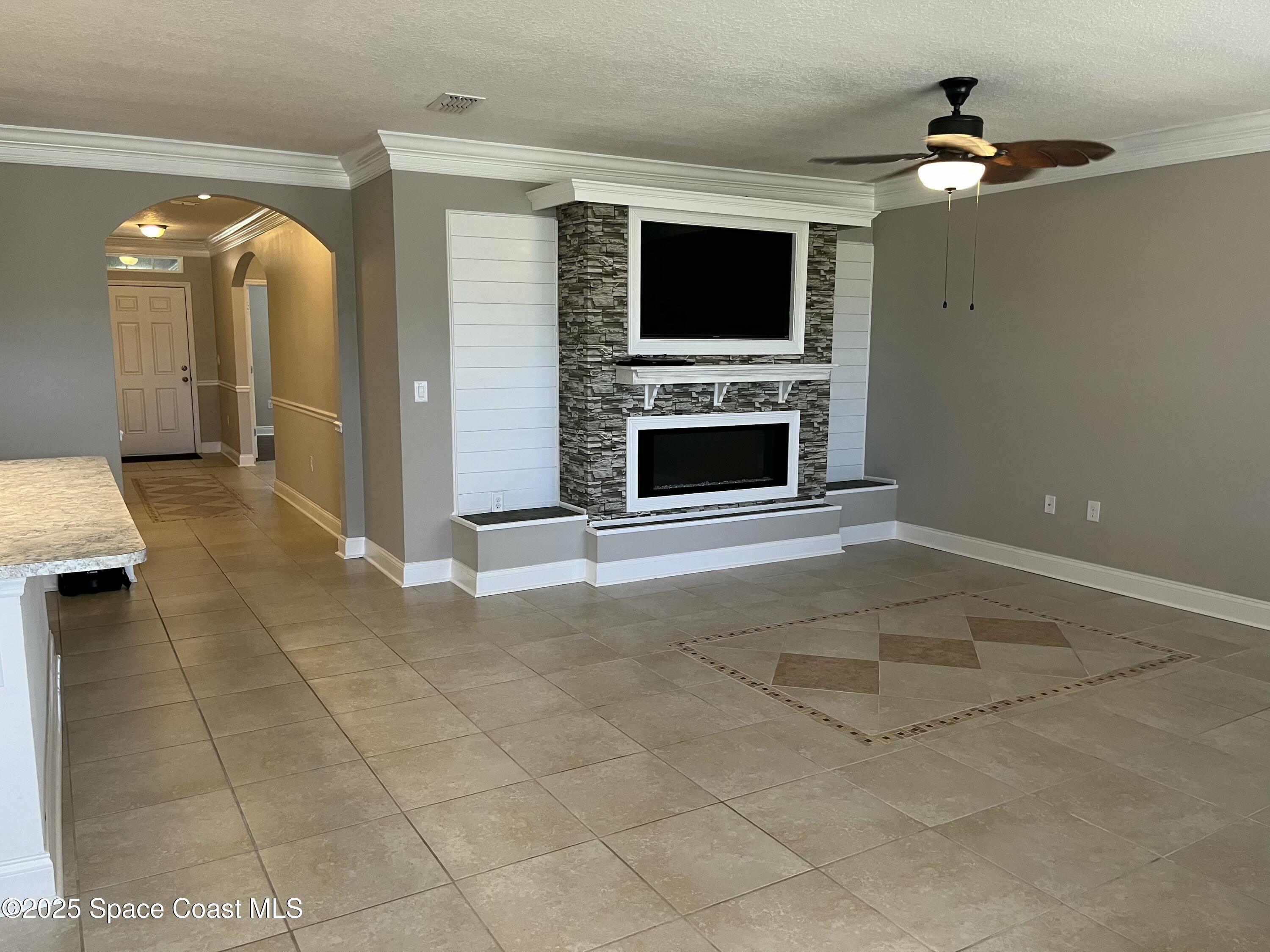 2209 McCormack Way Melbourne, FL 32935 - Photo 7 of 22 a view of a livingroom with a fireplace