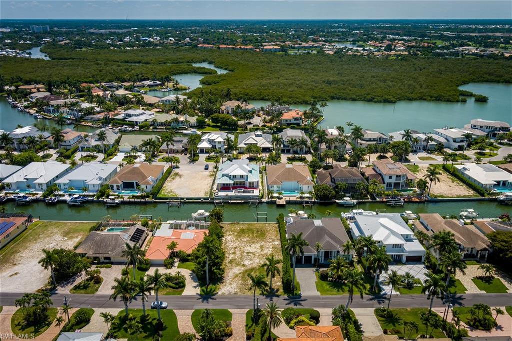2165 Tarpon Road Naples, FL 34102 - Photo 18 of 24 an aerial view of residential houses with outdoor space and river