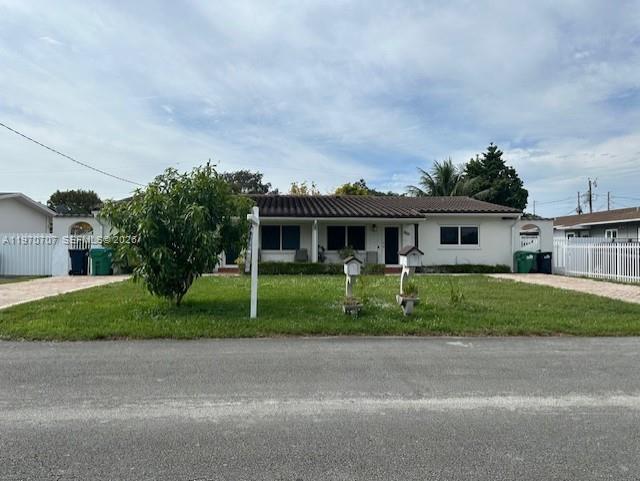 312 Southwest 76th Court, Unit 1 Miami, FL 33144 - Photo 1 of 18 a front view of a house with a garden
