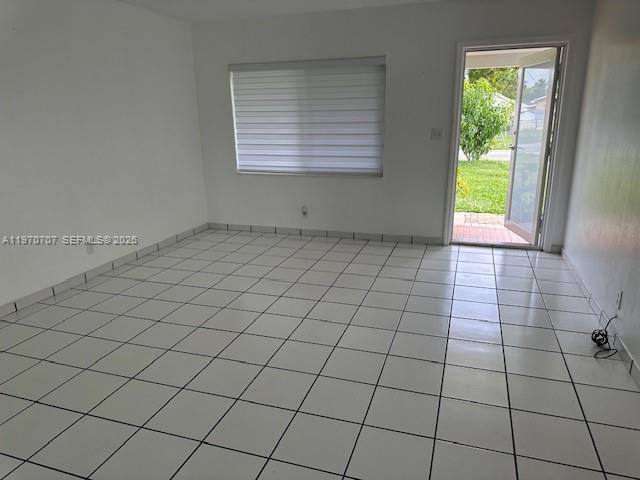 312 Southwest 76th Court, Unit 1 Miami, FL 33144 - Photo 14 of 18 a view of an empty room and window