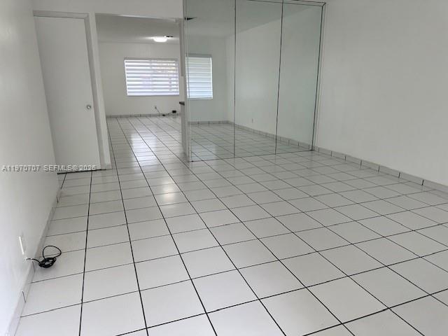 312 Southwest 76th Court, Unit 1 Miami, FL 33144 - Photo 5 of 18 a view of an empty room and window