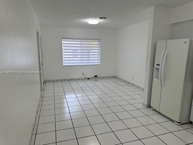 312 Southwest 76th Court, Unit 1 Miami, FL 33144 - Photo 9 of 18 a view of an empty room and window