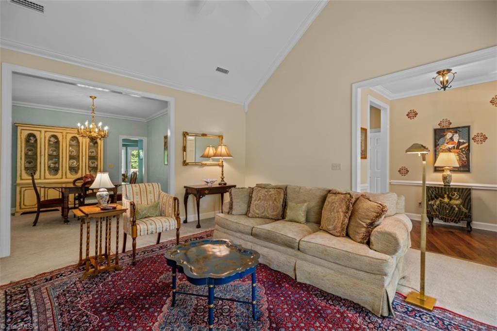 1255 Stadler Ridge Road Winston-Salem, NC 27106 - Photo 4 of 21 Living room with fireplace and vaulted ceilings