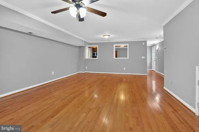 a view of room with wooden floor