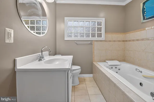 a bathroom with a sink a toilet and a bathtub