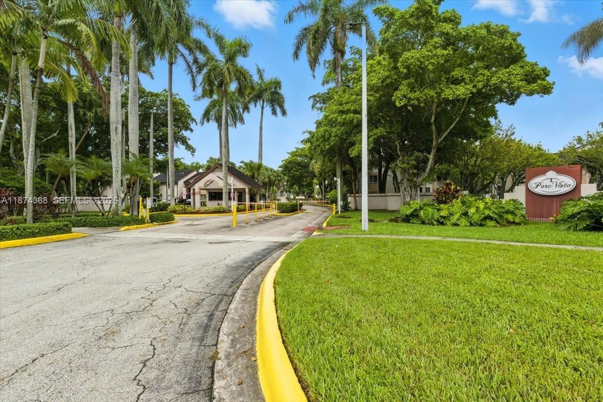 9167 Southwest 138th Place, Unit 9167 Miami, FL 33186 - Photo 11 of 16 a view of swimming pool with garden