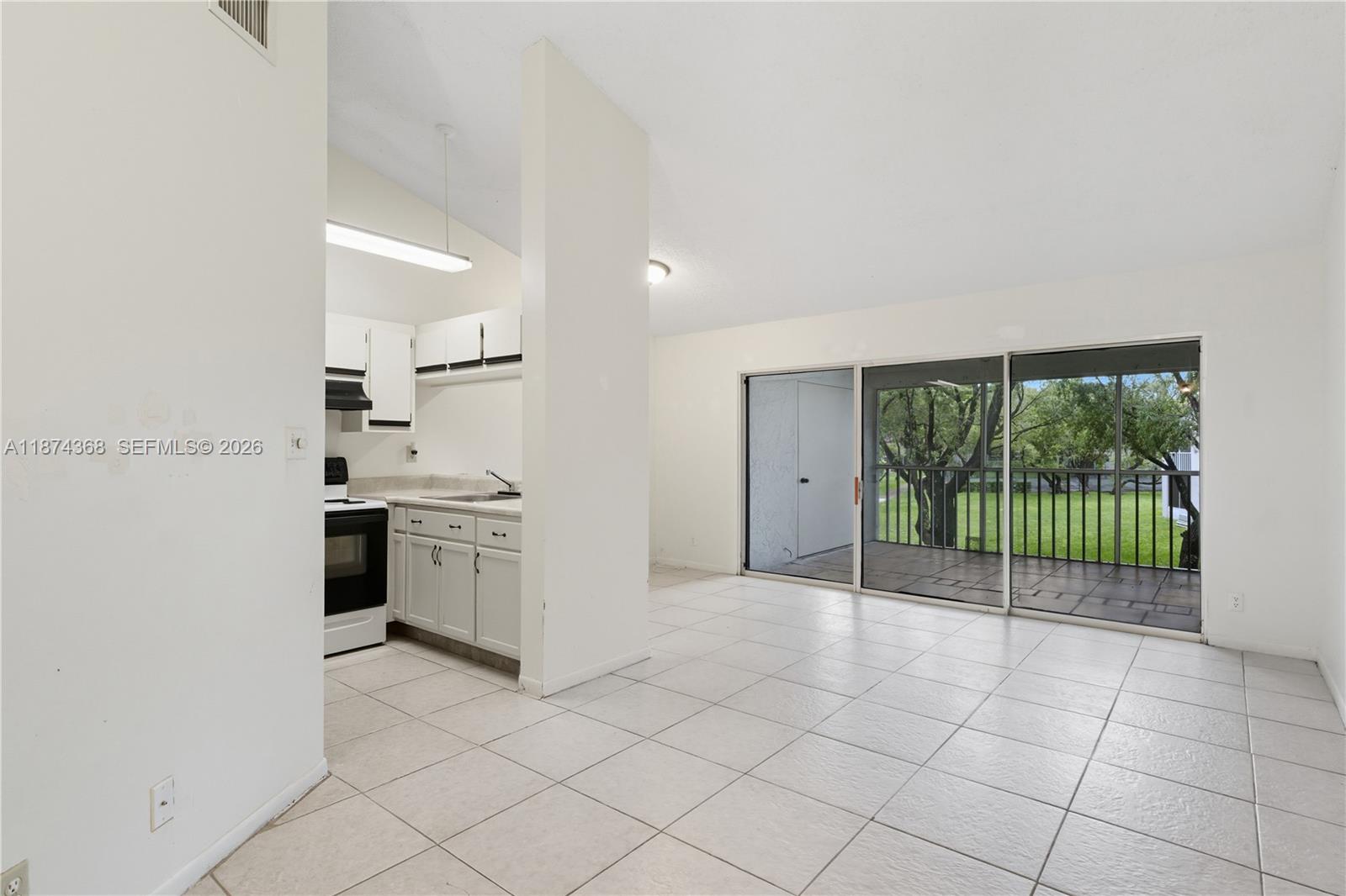 9167 Southwest 138th Place, Unit 9167 Miami, FL 33186 - Photo 2 of 16 a view of a kitchen with a sink and a stove top oven