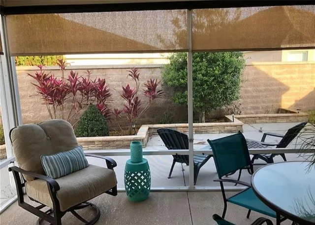 a living room with a flat screen tv and a toilet