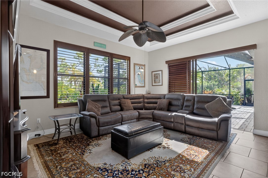 6109 Calusa Rdg Trail Bokeelia, FL 33922 - Photo 22 of 48 a living room with furniture and a large window