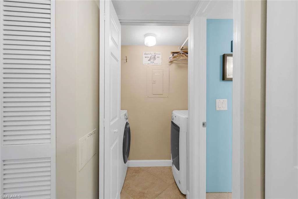 201 Quail Forest Boulevard, Unit 101 Naples, FL 34105 - Photo 23 of 32 a bathroom with a shower