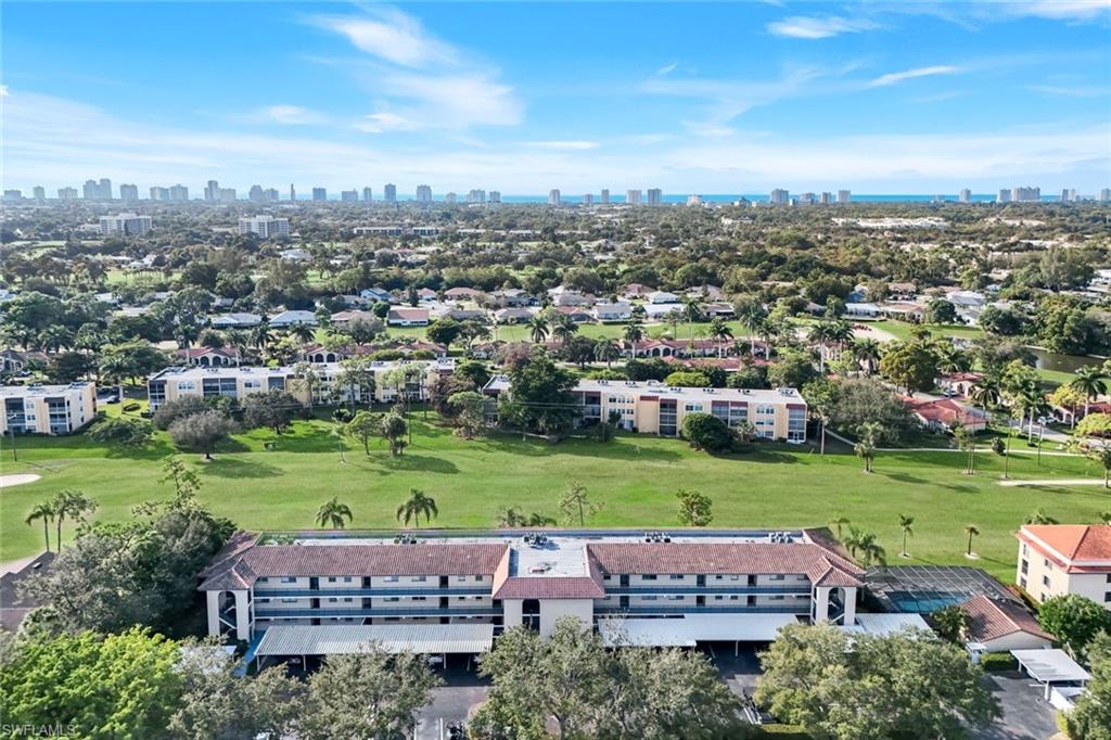 201 Quail Forest Boulevard, Unit 101 Naples, FL 34105 - Photo 27 of 32 an aerial view of a house with outdoor space