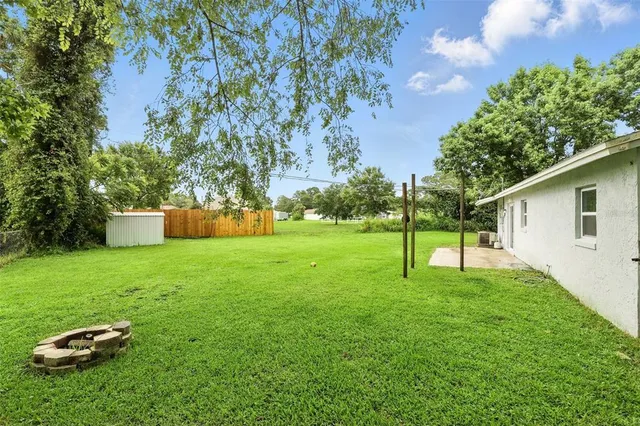 a garden with trees in front of it
