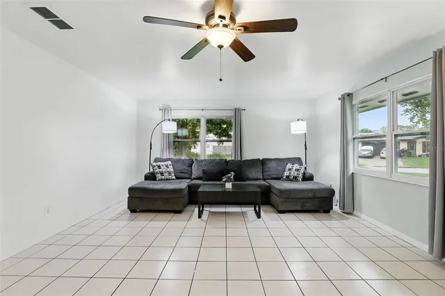 a living room with furniture and a window