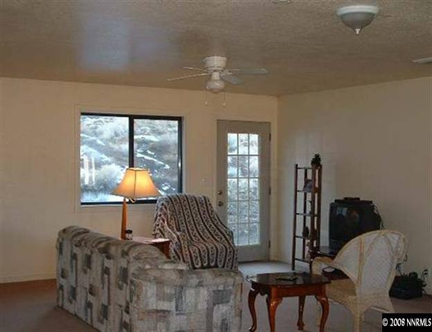 1000 Ironwood Road Reno, NV 89510 - Photo 2 of 4 a living room with furniture and a window