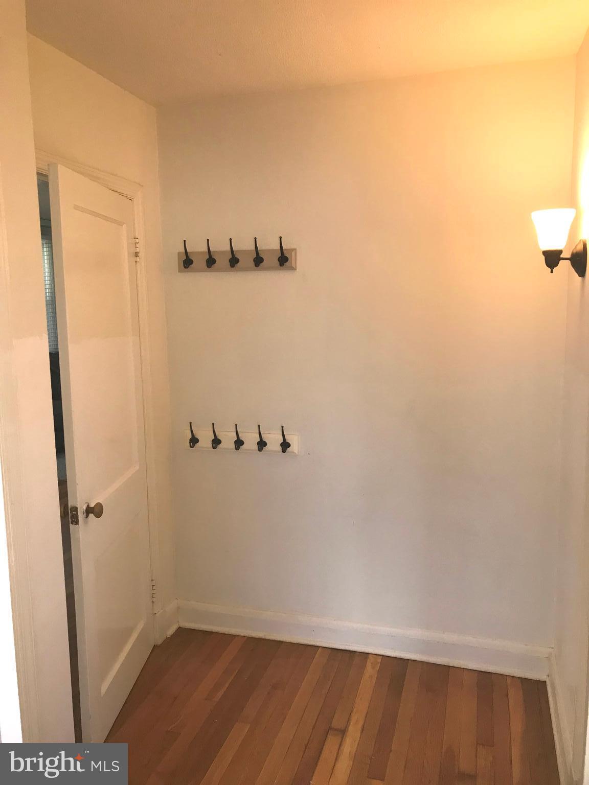 4212 Thorncliff Road Baltimore, MD 21236 - Photo 15 of 20 Hallway with coat hooks