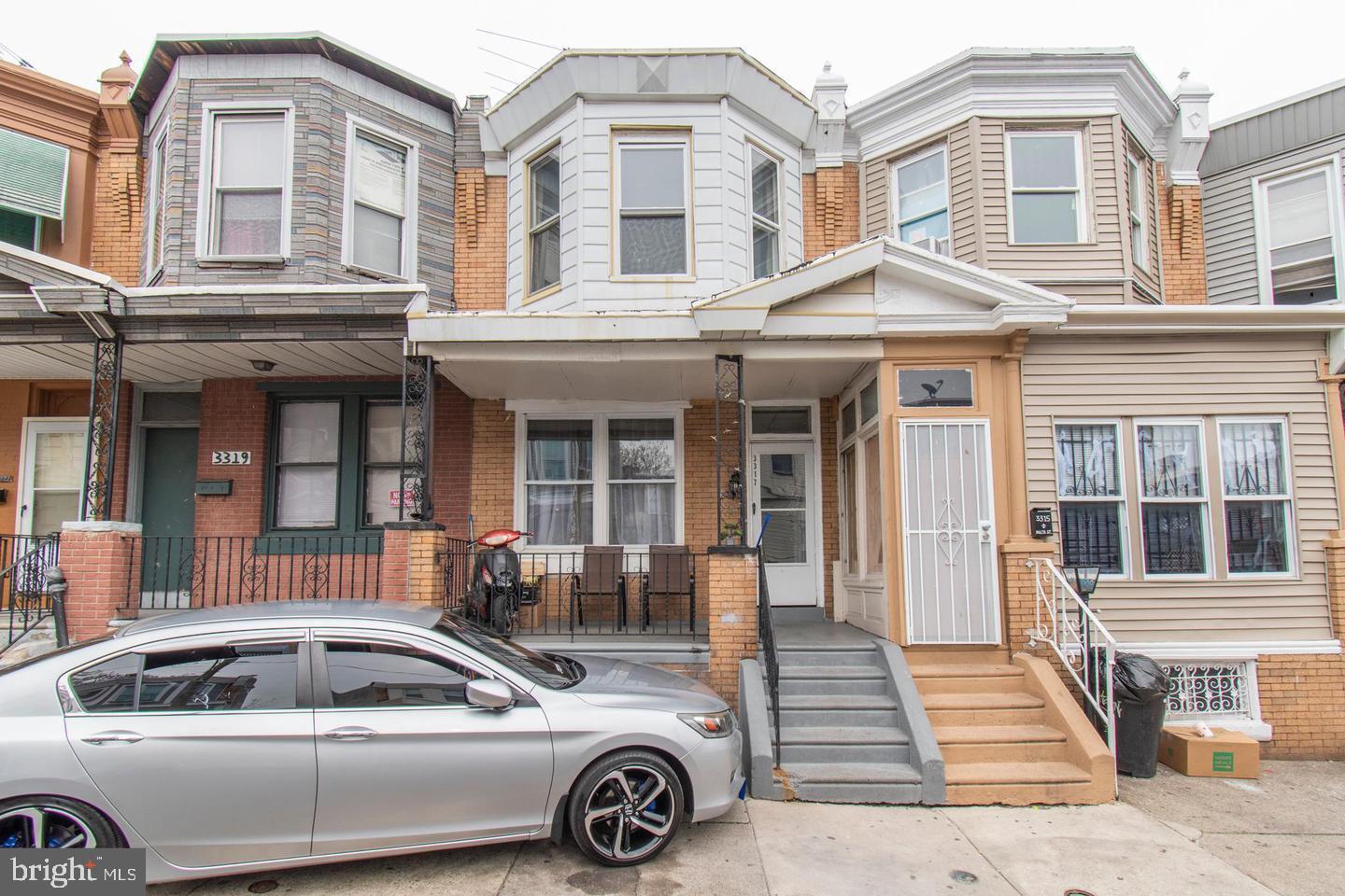 3317 Malta Street Philadelphia, PA 19134 - Photo 1 of 17 a car parked in front of a white building