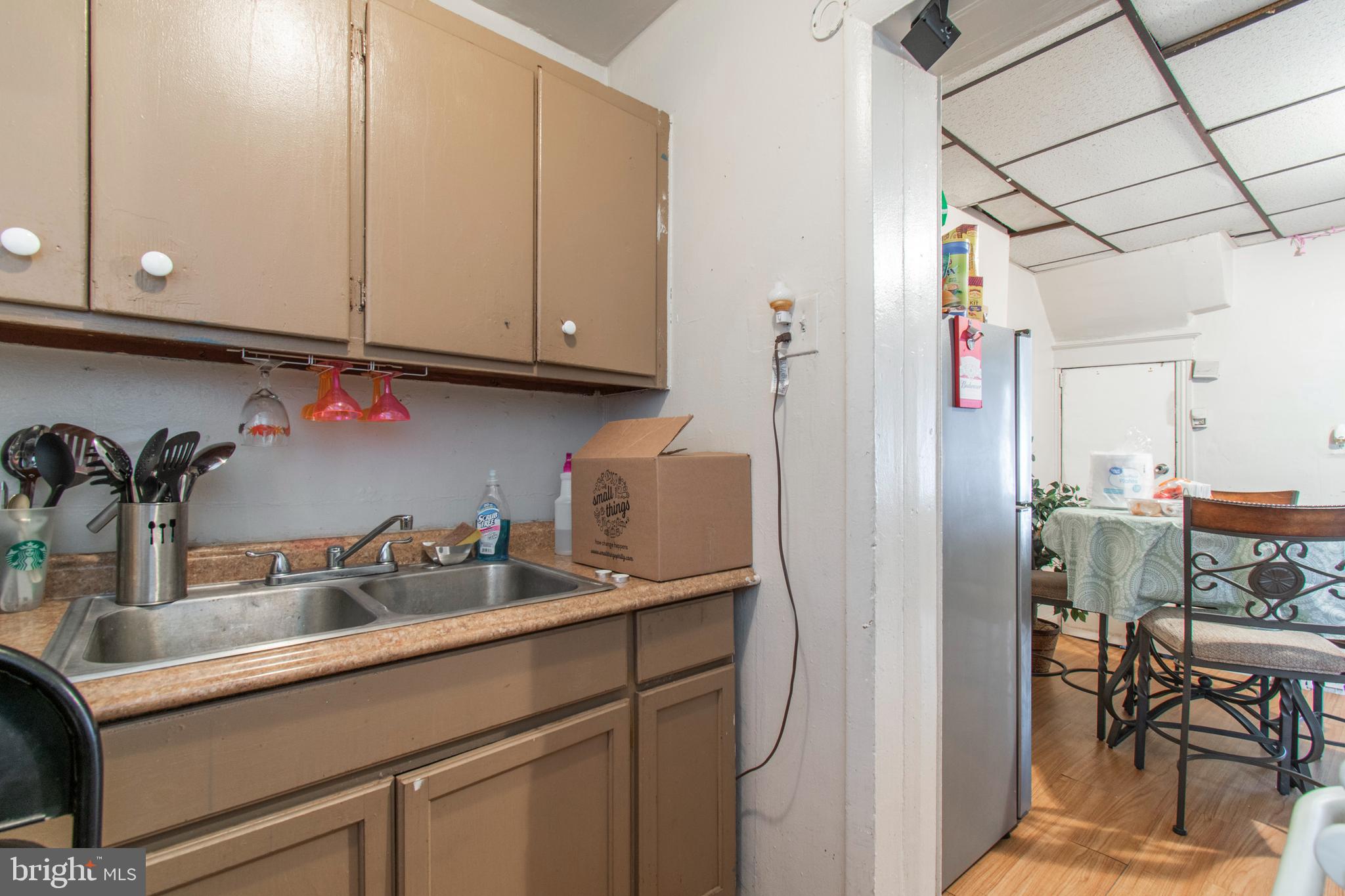 3317 Malta Street Philadelphia, PA 19134 - Photo 11 of 17 a kitchen with a sink and cabinets