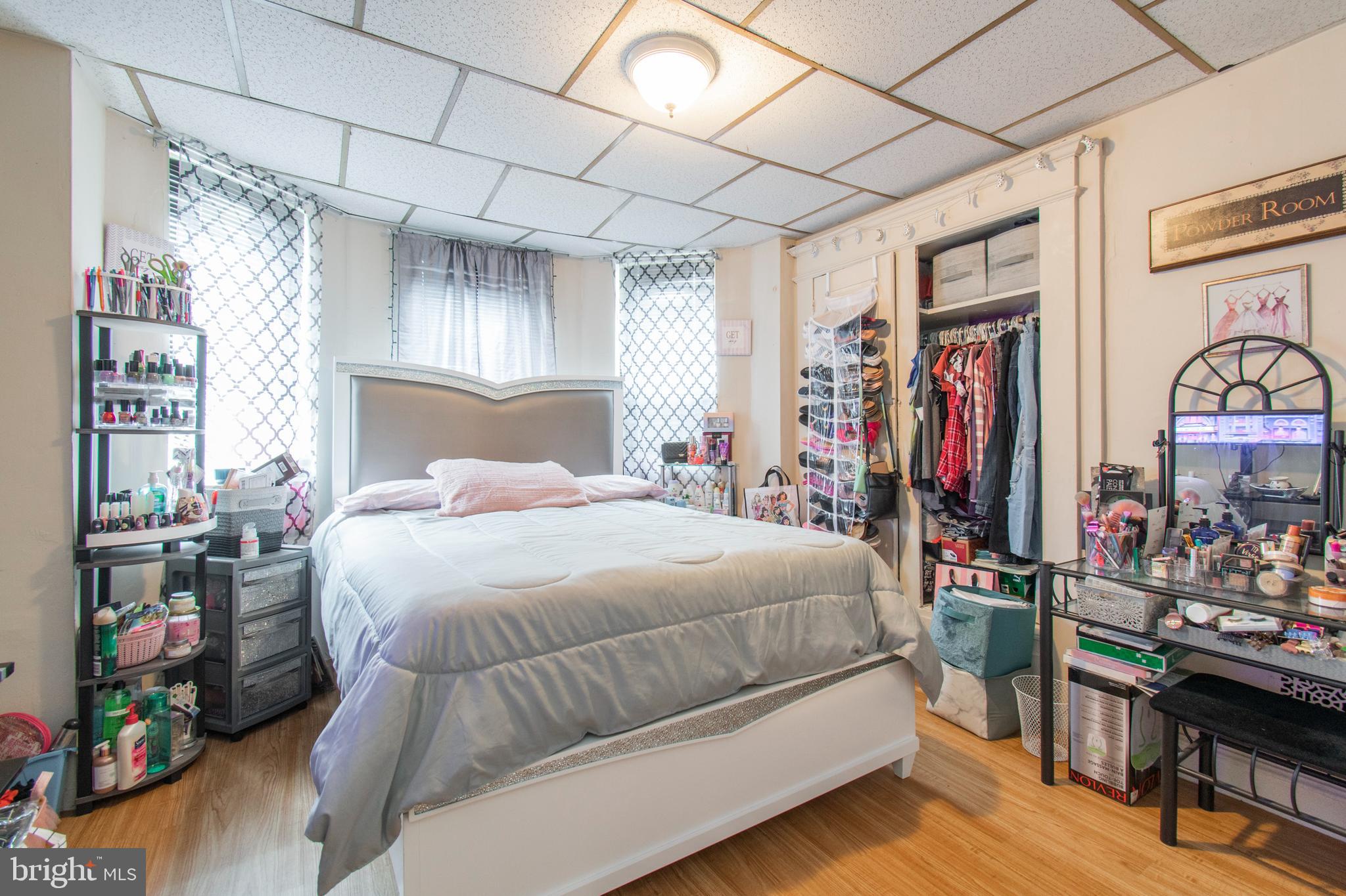 3317 Malta Street Philadelphia, PA 19134 - Photo 12 of 17 a bedroom with a large bed and a window