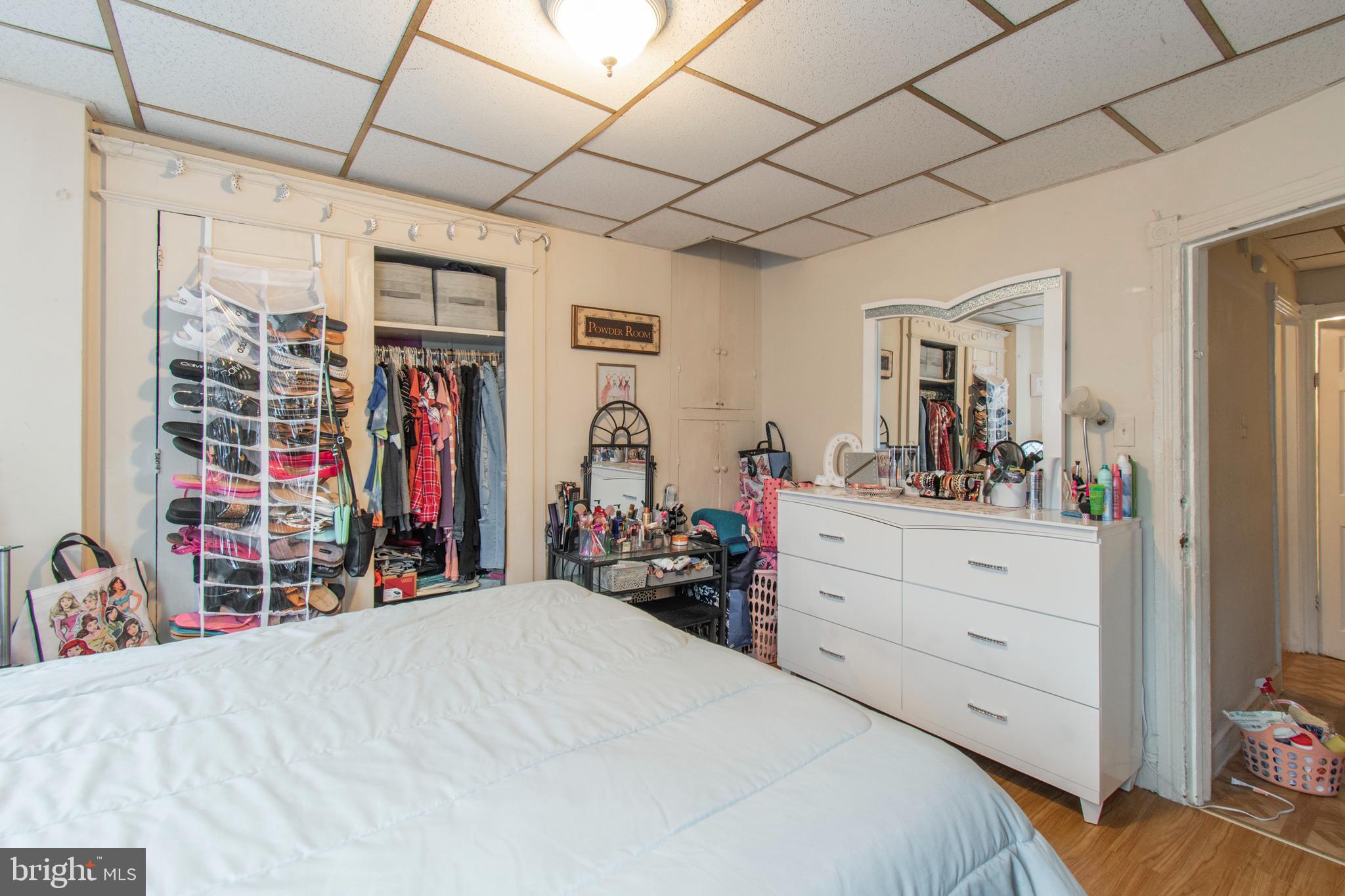 3317 Malta Street Philadelphia, PA 19134 - Photo 14 of 17 a bed room with a bed and a mirror