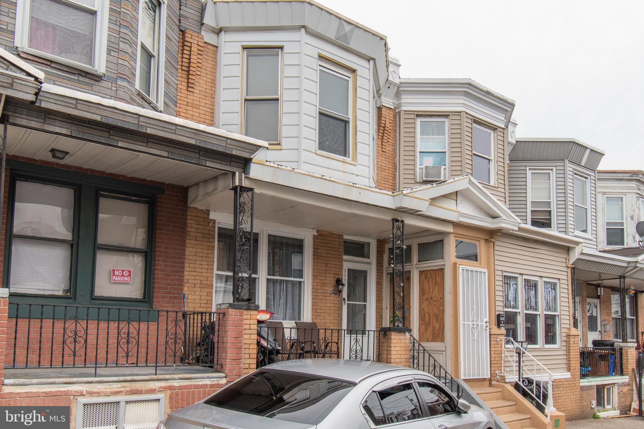 3317 Malta Street Philadelphia, PA 19134 - Photo 2 of 17 a front view of a building with a lot of windows