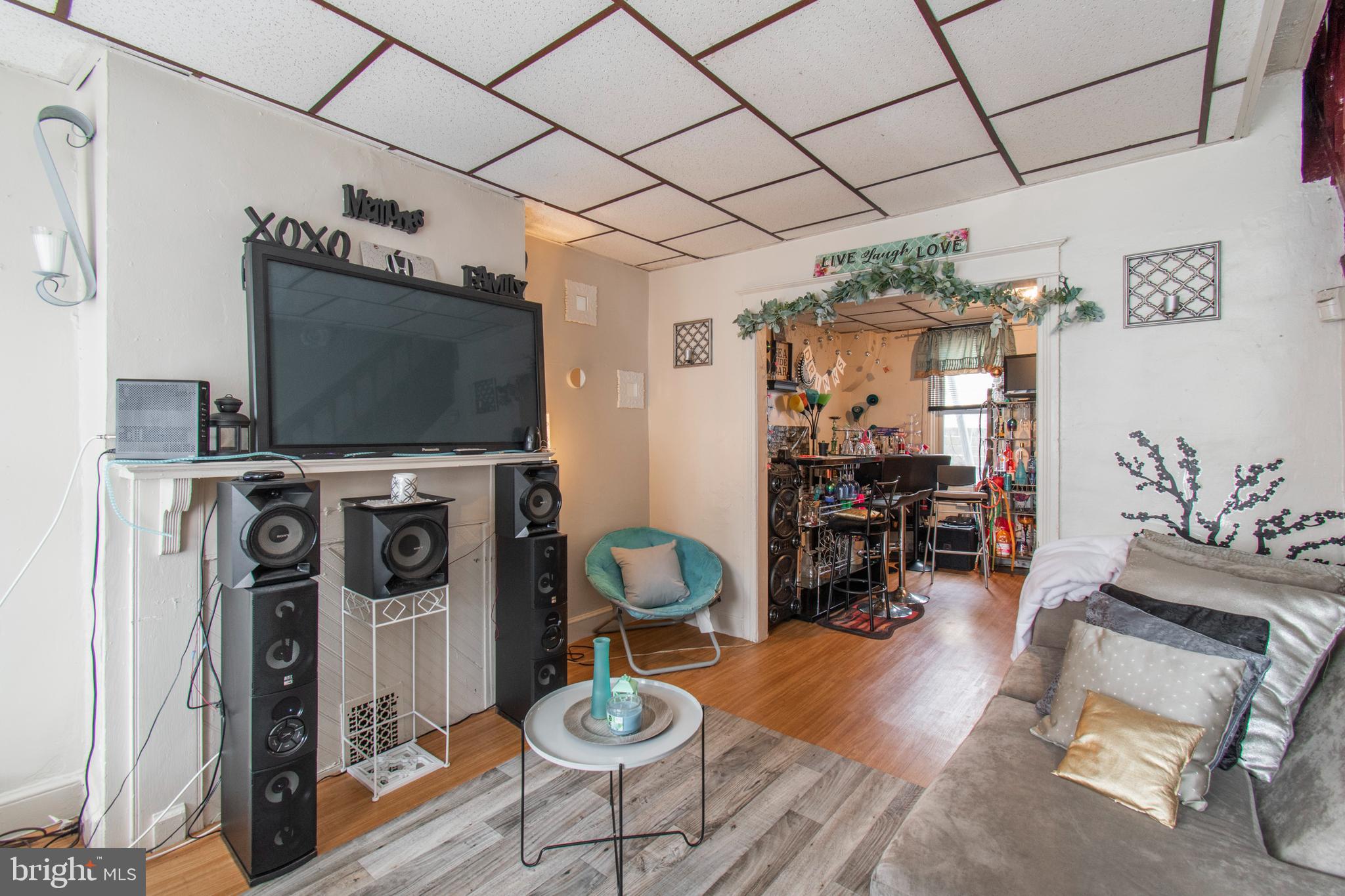 3317 Malta Street Philadelphia, PA 19134 - Photo 3 of 17 a living room with furniture and a flat screen tv