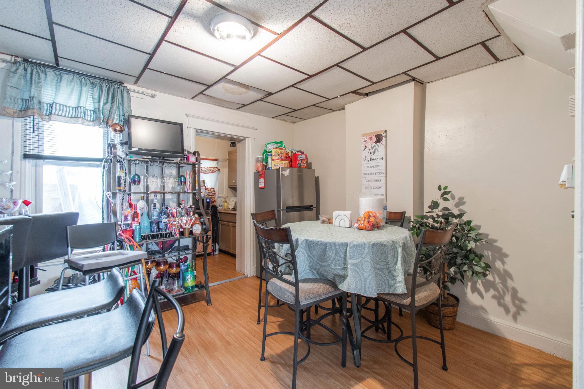 3317 Malta Street Philadelphia, PA 19134 - Photo 6 of 17 a view of a dining room with furniture window and wooden floor