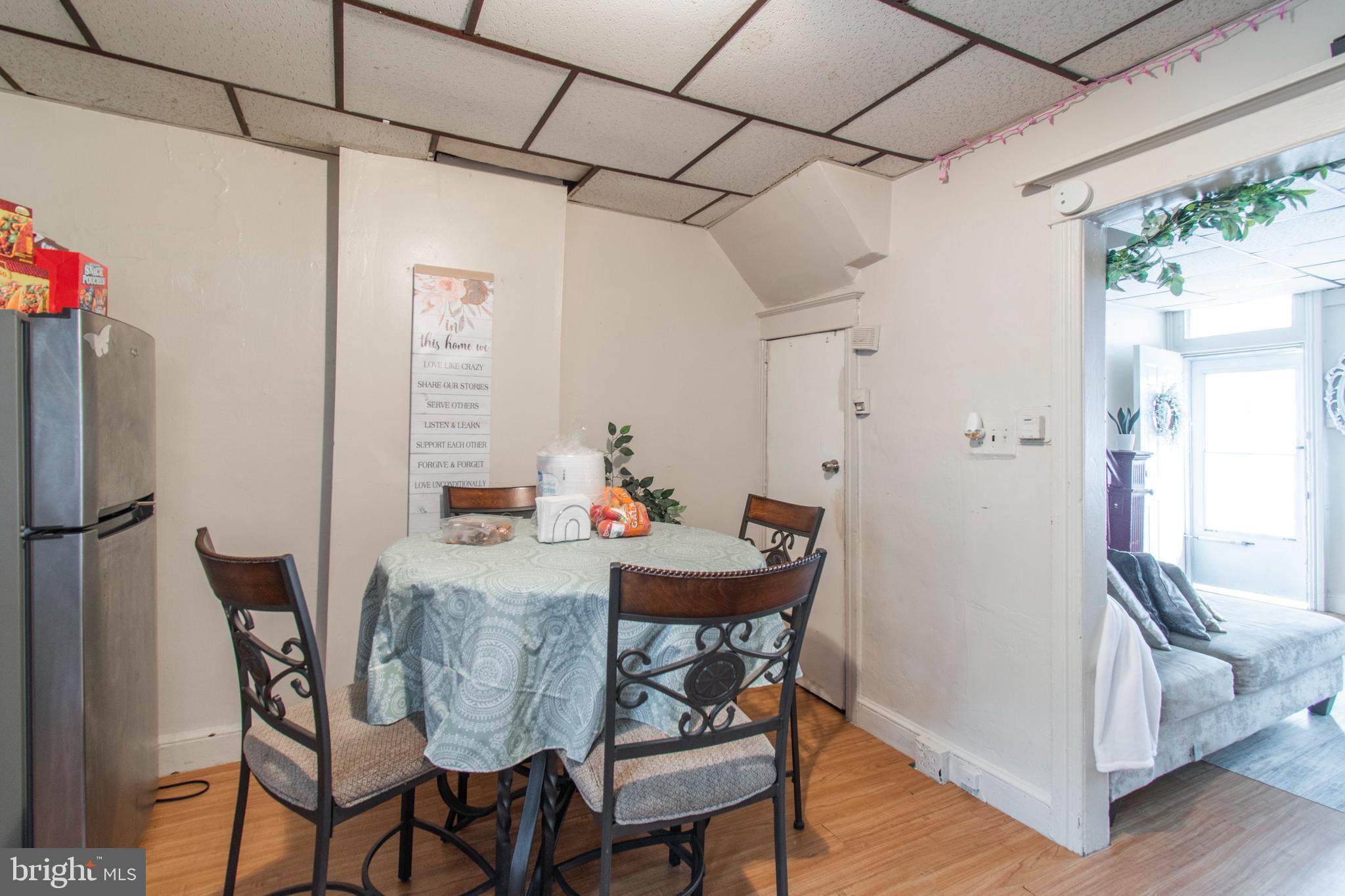 3317 Malta Street Philadelphia, PA 19134 - Photo 8 of 17 a view of a dining room with furniture window and wooden floor