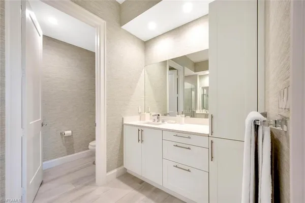 a bathroom with a double vanity sink and mirror