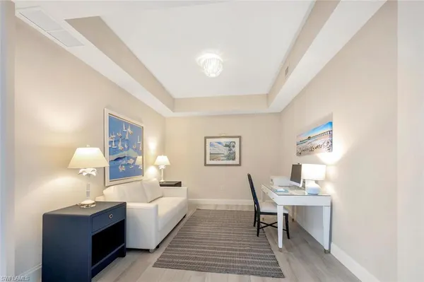 a room with a bed and a table in it