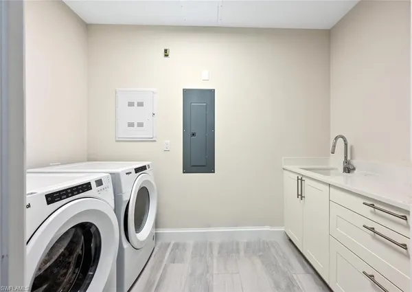 a view of storage and utility room with washer and dryer