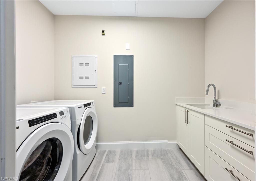 1111 Central Avenue, Unit 511 Naples, FL 34102 - Photo 31 of 50 a view of storage and utility room with washer and dryer