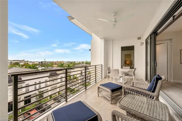 a view of a balcony with chairs