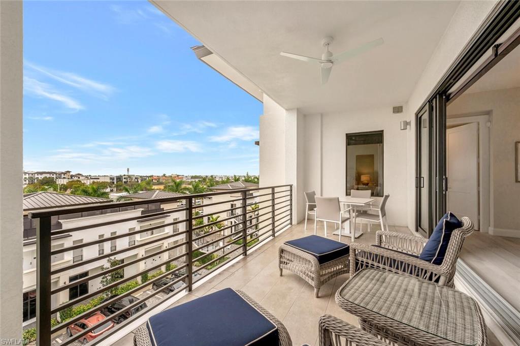1111 Central Avenue, Unit 511 Naples, FL 34102 - Photo 34 of 50 a view of a balcony with chairs