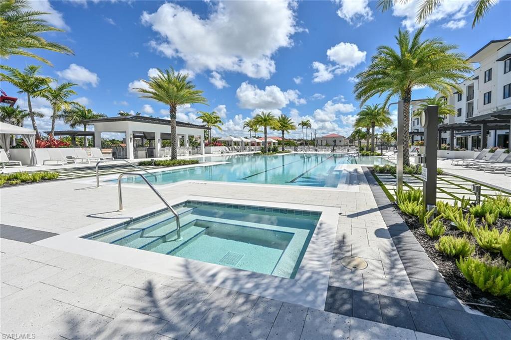 1111 Central Avenue, Unit 511 Naples, FL 34102 - Photo 36 of 50 a view of a swimming pool with a patio