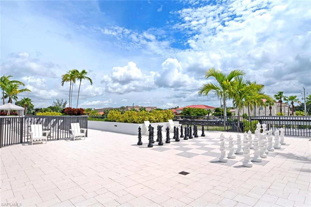 1111 Central Avenue, Unit 511 Naples, FL 34102 - Photo 40 of 50 a view of swimming pool with outdoor seating