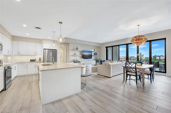 a kitchen with counter top space cabinets and appliances