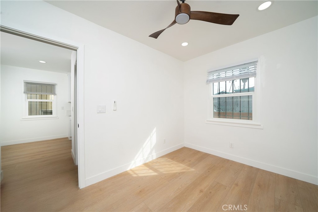 1048 Cedar Avenue Long Beach, CA 90813 - Photo 4 of 7 an empty room with a window and ceiling fan