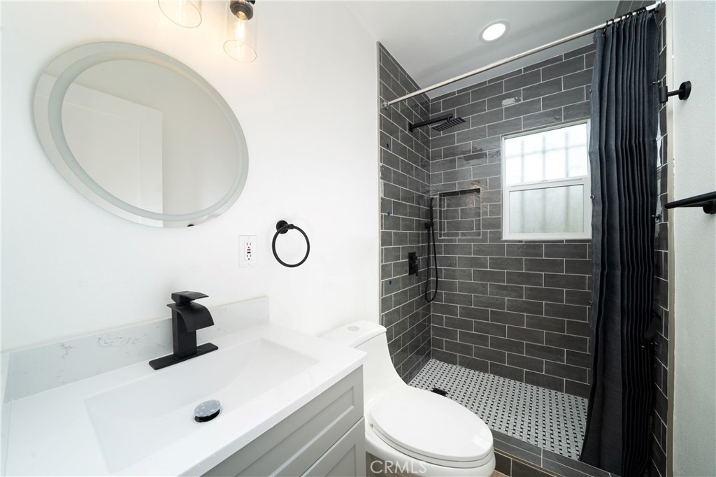 1048 Cedar Avenue Long Beach, CA 90813 - Photo 5 of 7 a bathroom with a sink toilet and shower