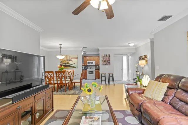 a bathroom with a granite countertop sink a mirror and a shower