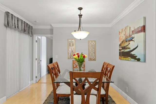 a dining room with furniture and window