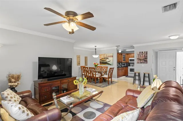 a bedroom with a bed and dresser with chair