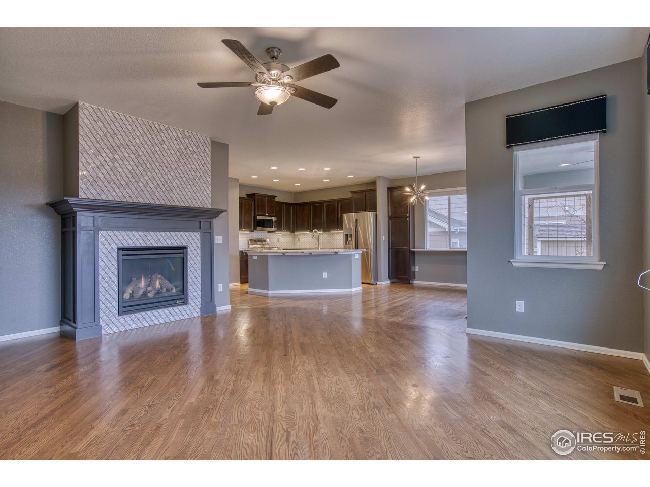 8552 Raspberry Drive Frederick, CO 80504 - Photo 14 of 40 a view of an empty room and a kitchen