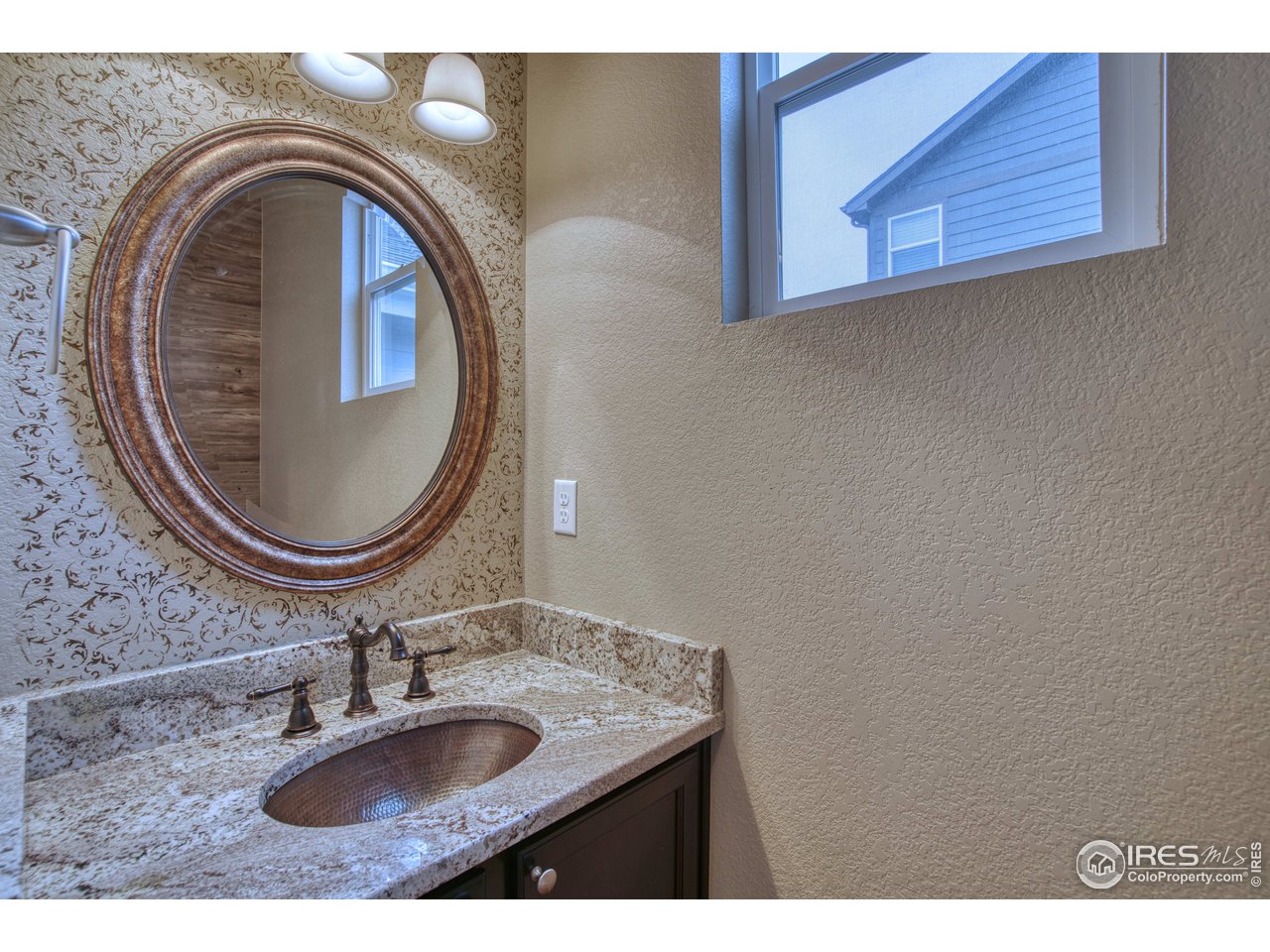 8552 Raspberry Drive Frederick, CO 80504 - Photo 15 of 40 a bathroom with a sink and a mirror