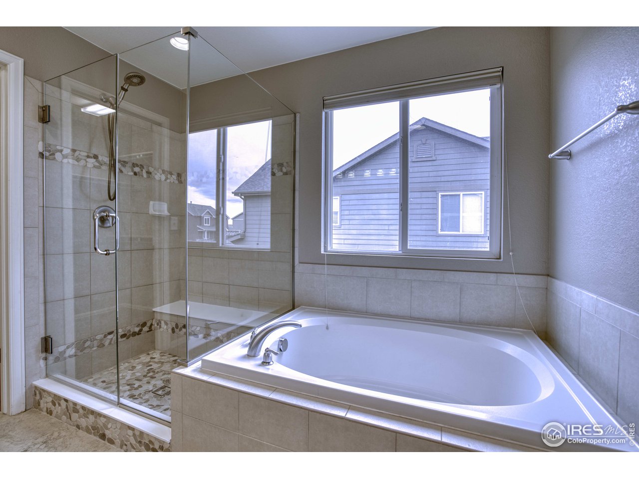 8552 Raspberry Drive Frederick, CO 80504 - Photo 17 of 40 a bath tub sitting next to a window