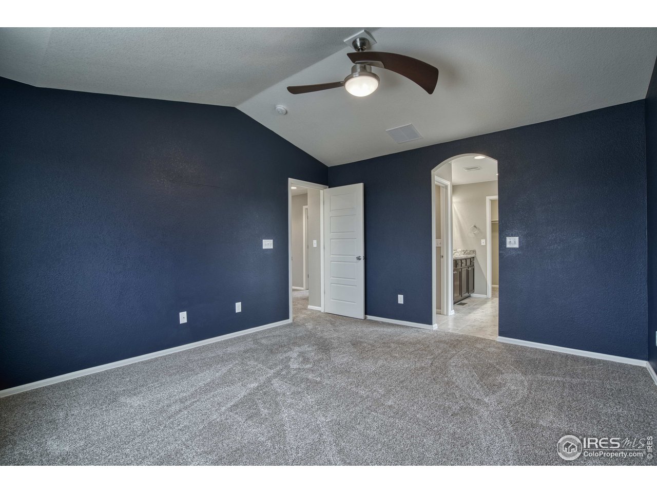 8552 Raspberry Drive Frederick, CO 80504 - Photo 19 of 40 a view of an empty room with a chandelier fan