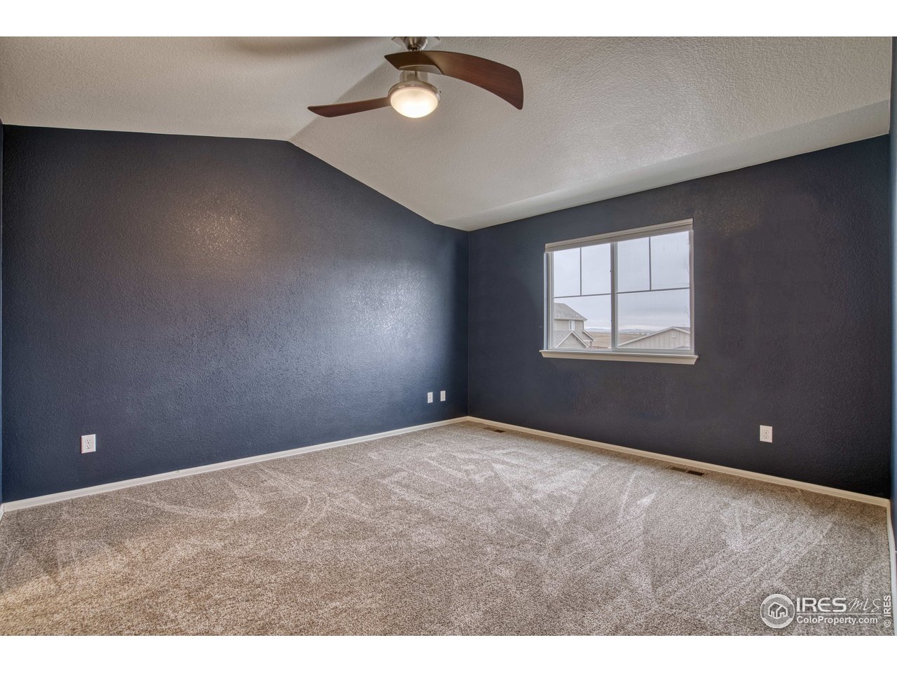 8552 Raspberry Drive Frederick, CO 80504 - Photo 20 of 40 a view of an empty room with a window