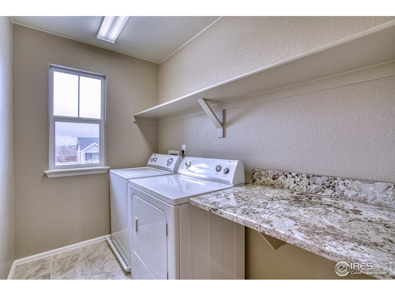 8552 Raspberry Drive Frederick, CO 80504 - Photo 21 of 40 a room with storage and utility