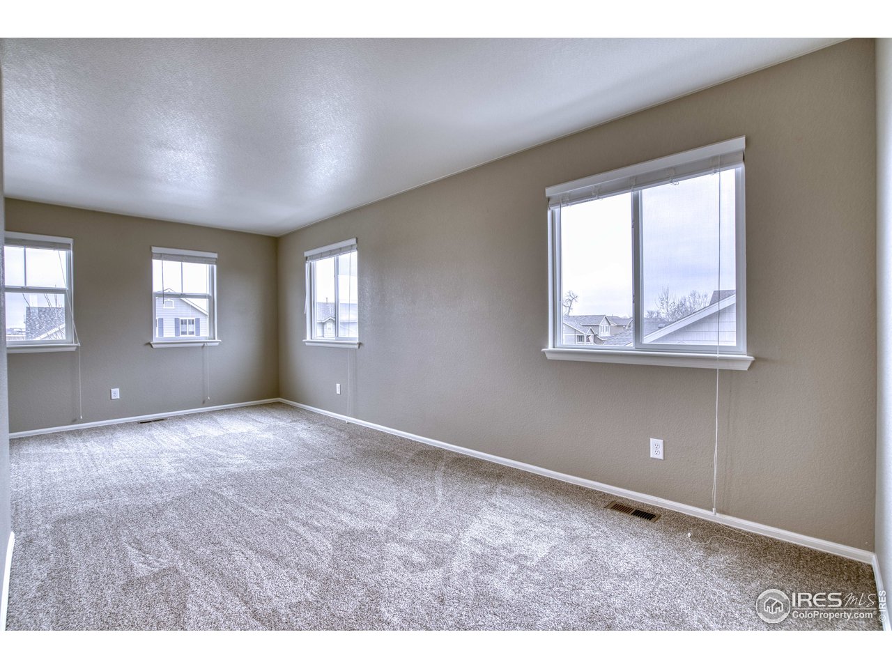8552 Raspberry Drive Frederick, CO 80504 - Photo 24 of 40 a view of an empty room with a window