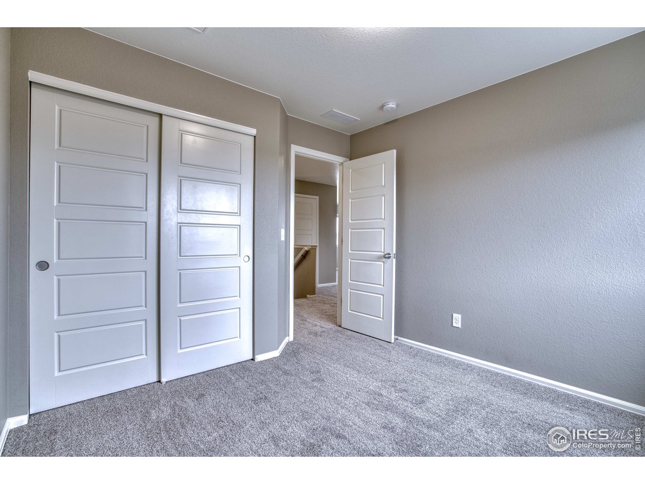 8552 Raspberry Drive Frederick, CO 80504 - Photo 26 of 40 a view of an empty room and closet area